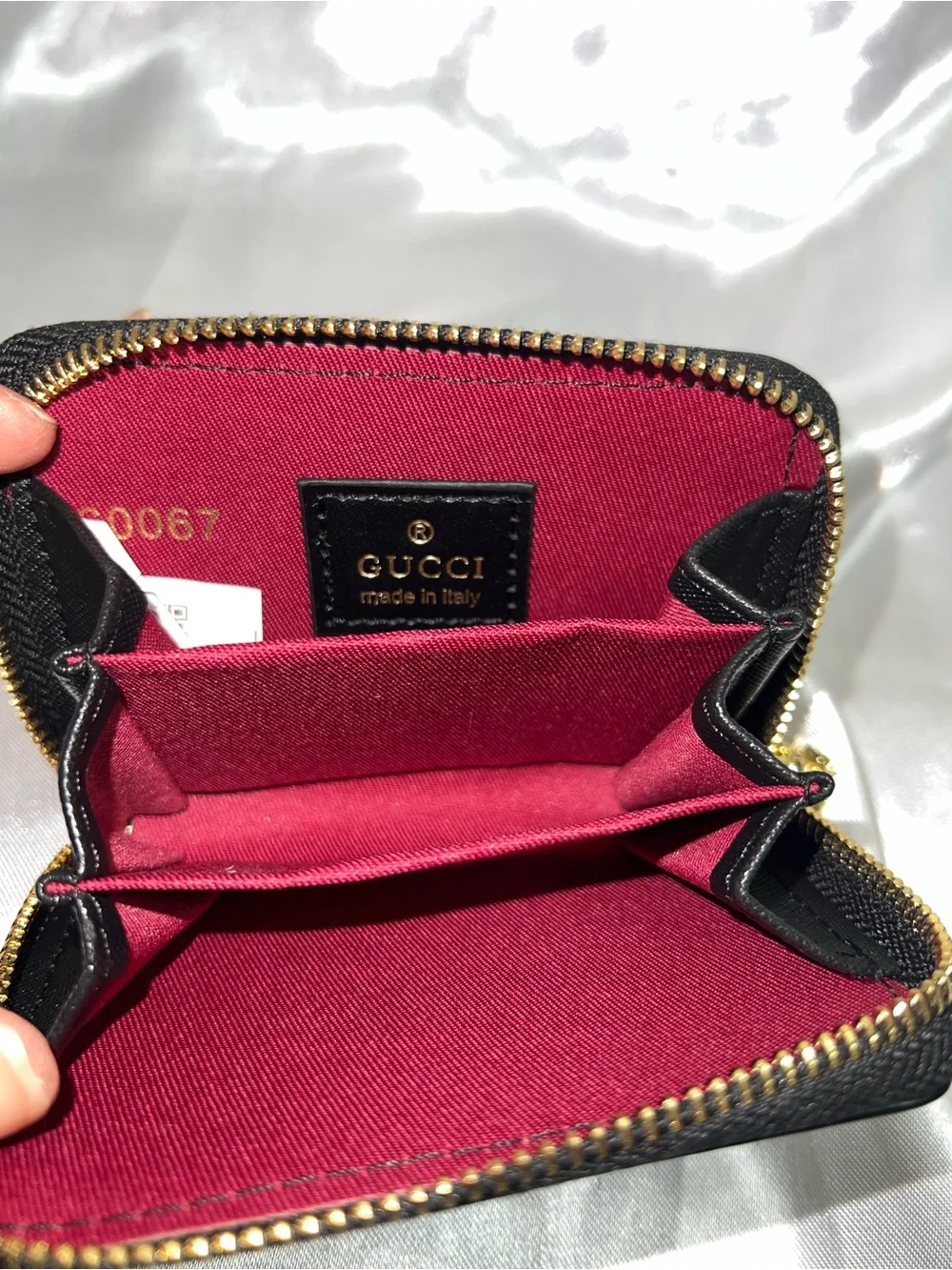 Black Quilted Leather Zip Wallet with Gold Emblem